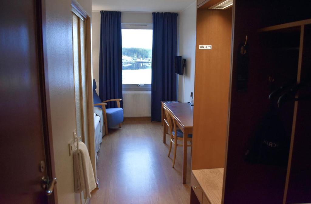 Postel nebo postele na pokoji v ubytování First Hotel Bengtsfors