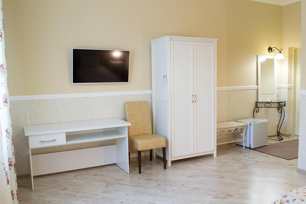 TV a/nebo společenská místnost v ubytování Green Hall Hotel