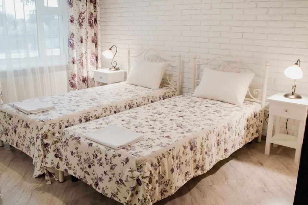 Postel nebo postele na pokoji v ubytování Green Hall Hotel