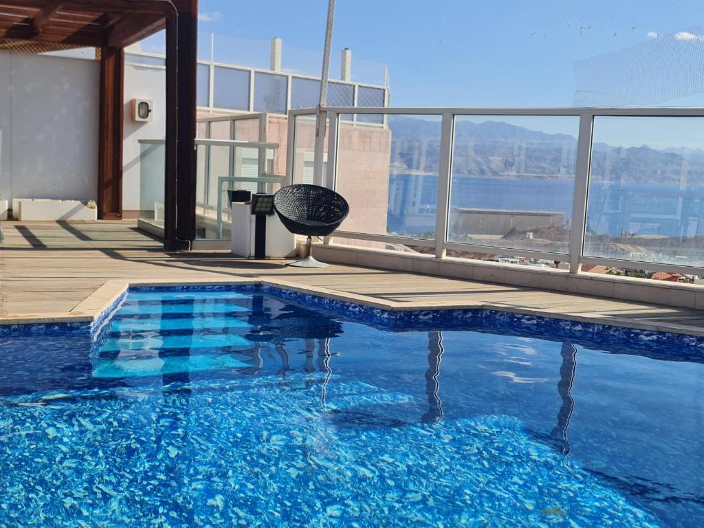 a swimming pool on top of a building at Exclusive Top Luxury Penthouse near the sea with Privat Roof-Pool in Eilat