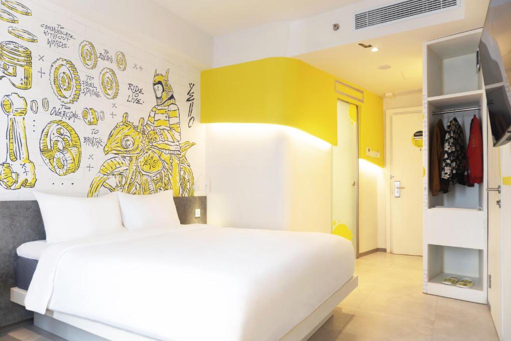 Postel nebo postele na pokoji v ubytování Yello Hotel Jambi