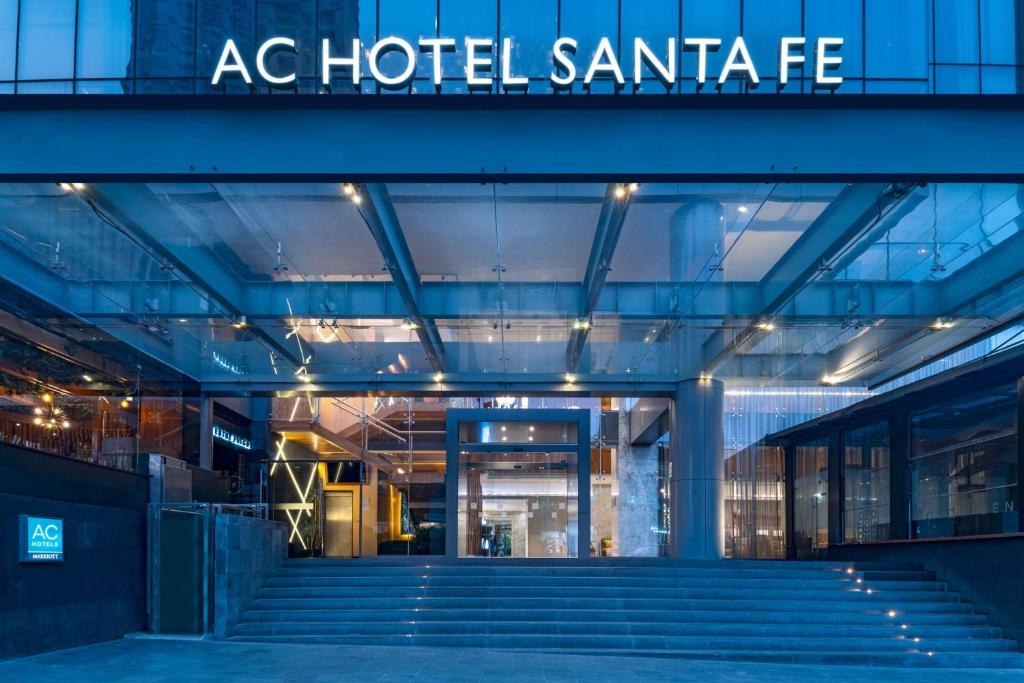 a building with stairs and a sign that reads ac hotel santa fe at AC Hotel by Marriott Santa Fe in Mexico City
