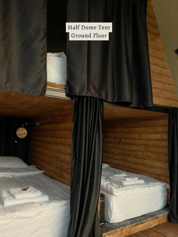 Postel nebo postele na pokoji v ubytování Glamping Tago
