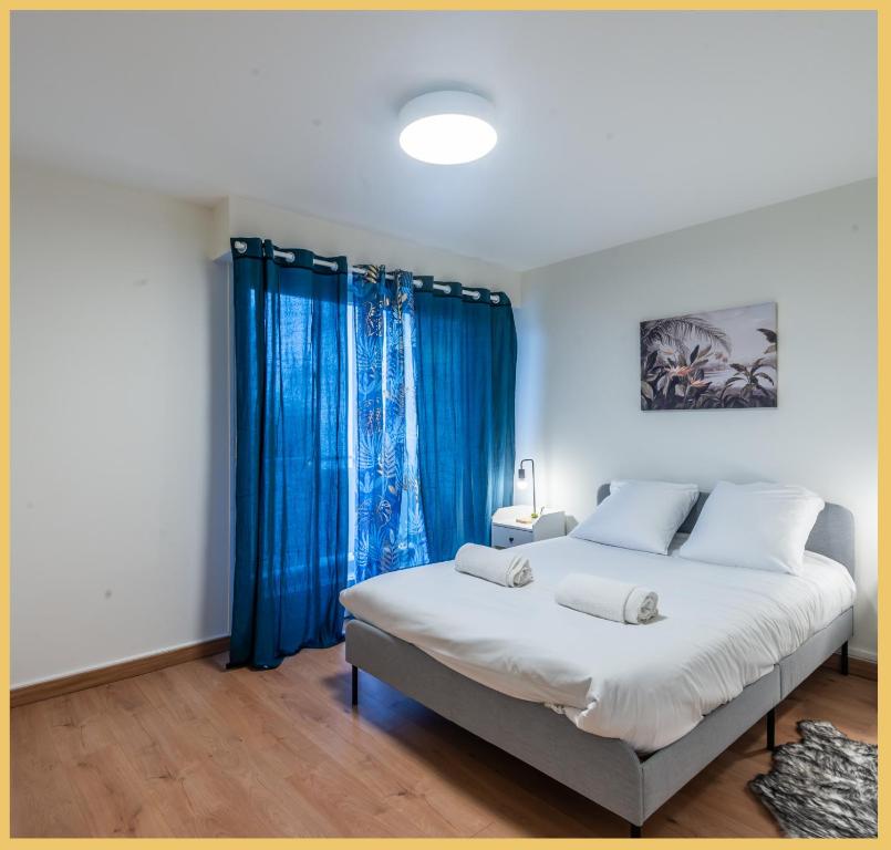 Una cama o camas en una habitaci&oacute;n de Appartement T2 Moderne Gaillard