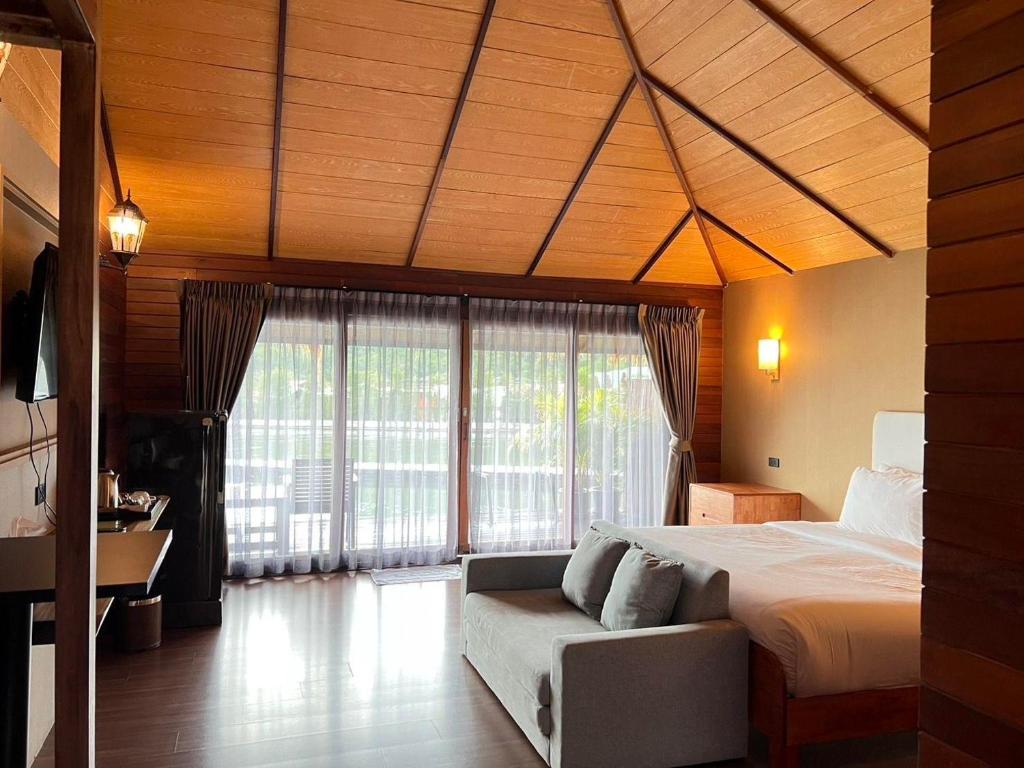 Postel nebo postele na pokoji v ubytování Ruknam Resort