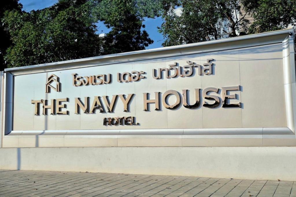 a sign for the may house at a building at THE NAVY HOUSE HOTEL in Sattahip