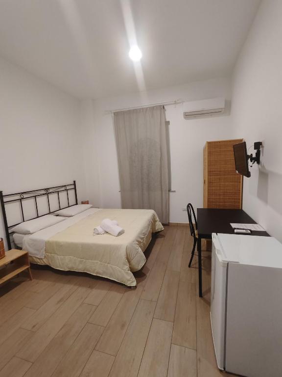 Postel nebo postele na pokoji v ubytování Hotel Faraglione
