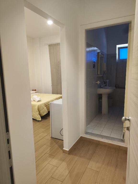 Postel nebo postele na pokoji v ubytování Hotel Faraglione