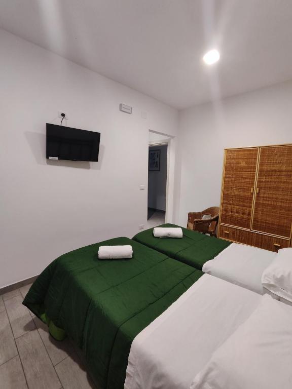 Postel nebo postele na pokoji v ubytování Hotel Faraglione