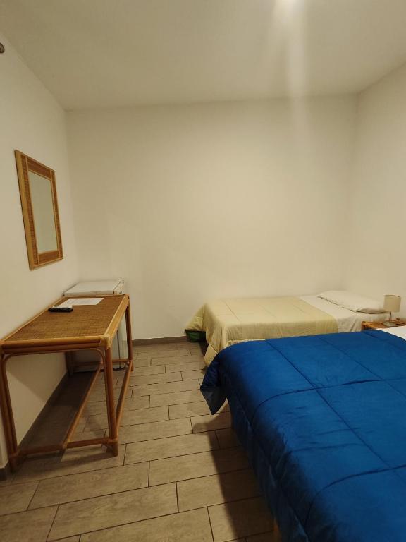 Postel nebo postele na pokoji v ubytování Hotel Faraglione