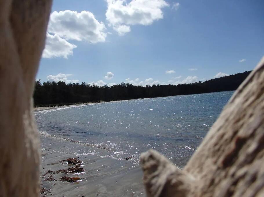 a view of a body of water from a pier at Bec's Beach House Getaway in Batemans Bay