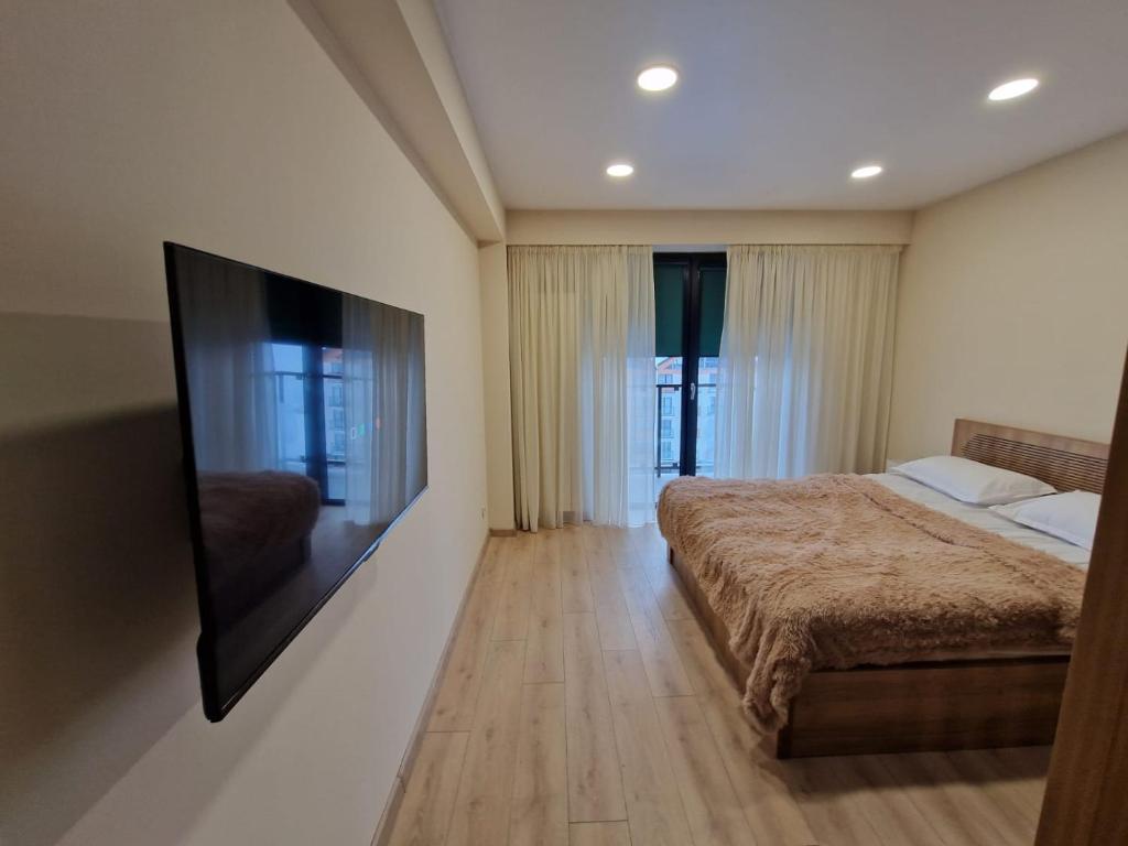 Postel nebo postele na pokoji v ubytování Cozy House New Gudauri