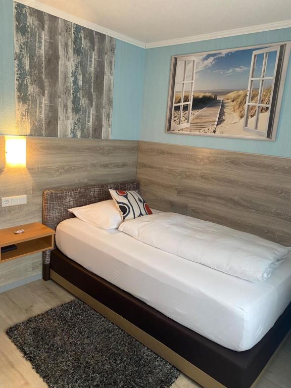 Postel nebo postele na pokoji v ubytování Hotel Harbauer