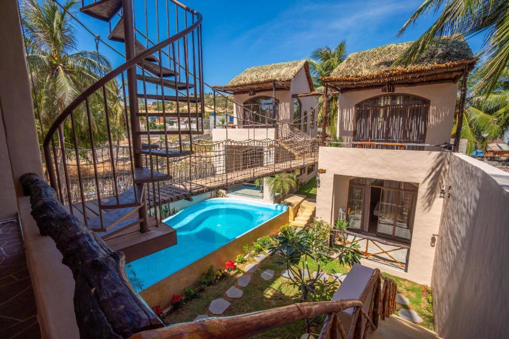 an aerial view of a house with a swimming pool at Red Sands Pool Villa in Phan Thiet