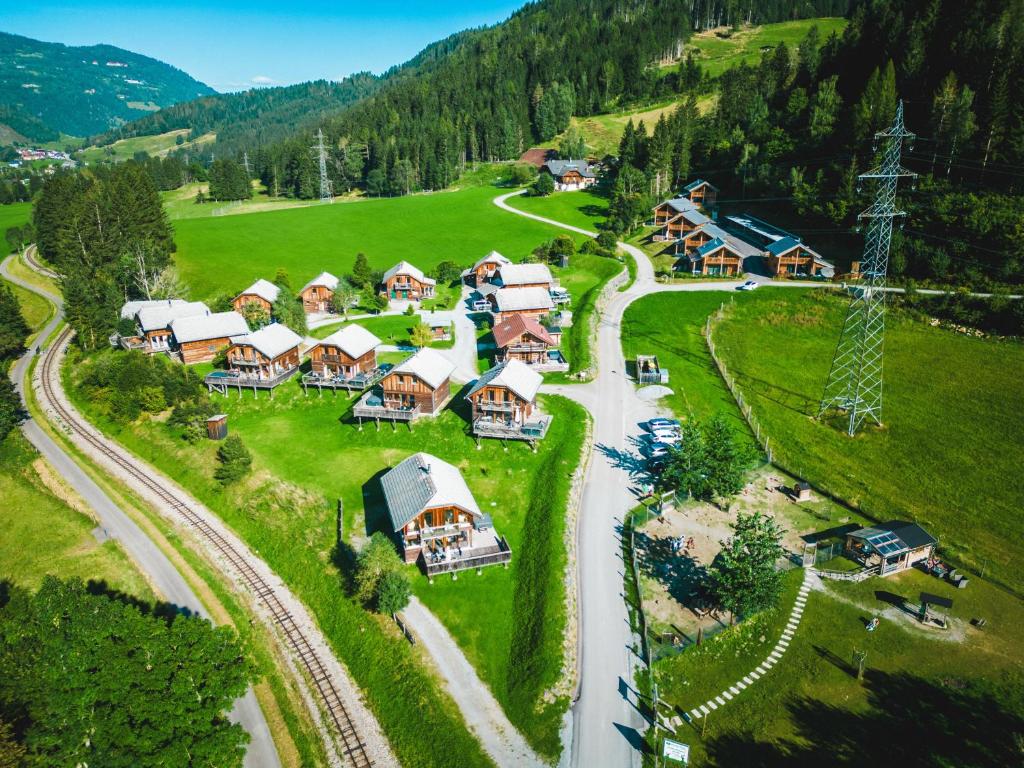 an aerial view of a village in the mountains at Woody Park in Sankt Georgen ob Murau