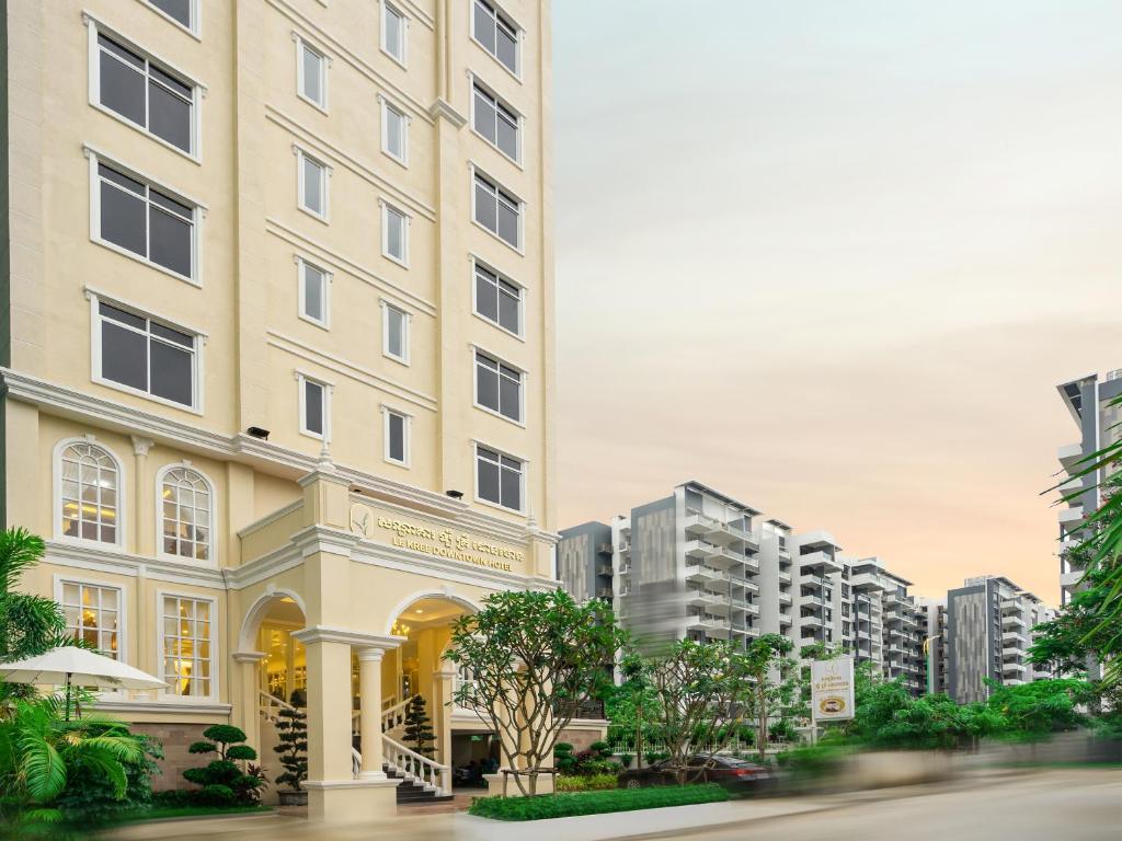 a rendering of a building with tall buildings at Le Kree Downtown Hotel in Phnom Penh