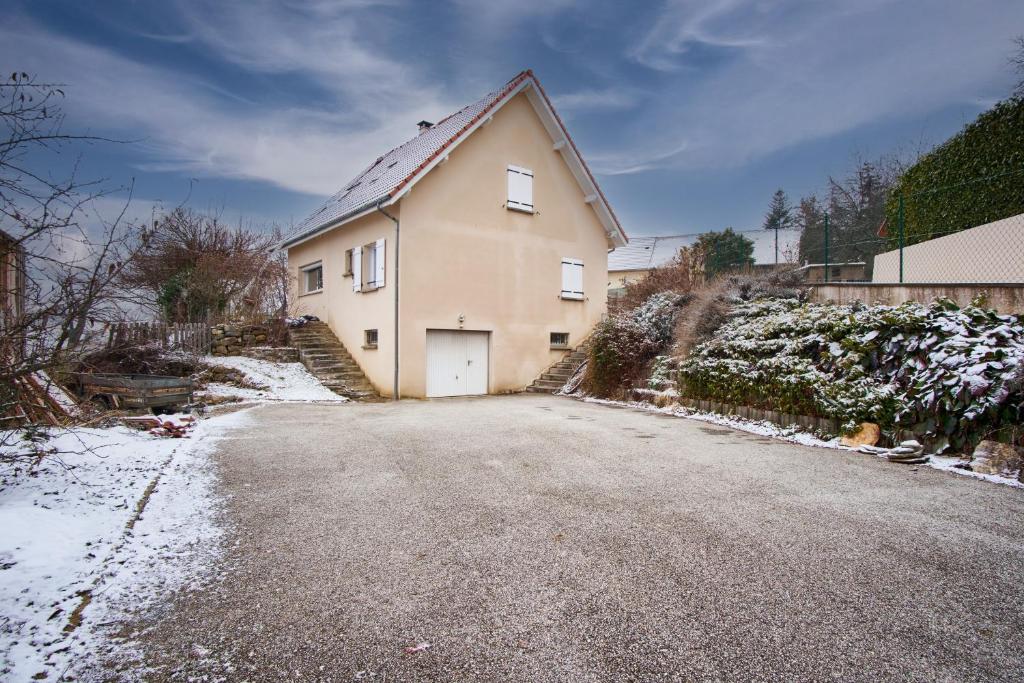a house on a street with snow on the ground at La Matheysiene in La Motte-dʼAveillans