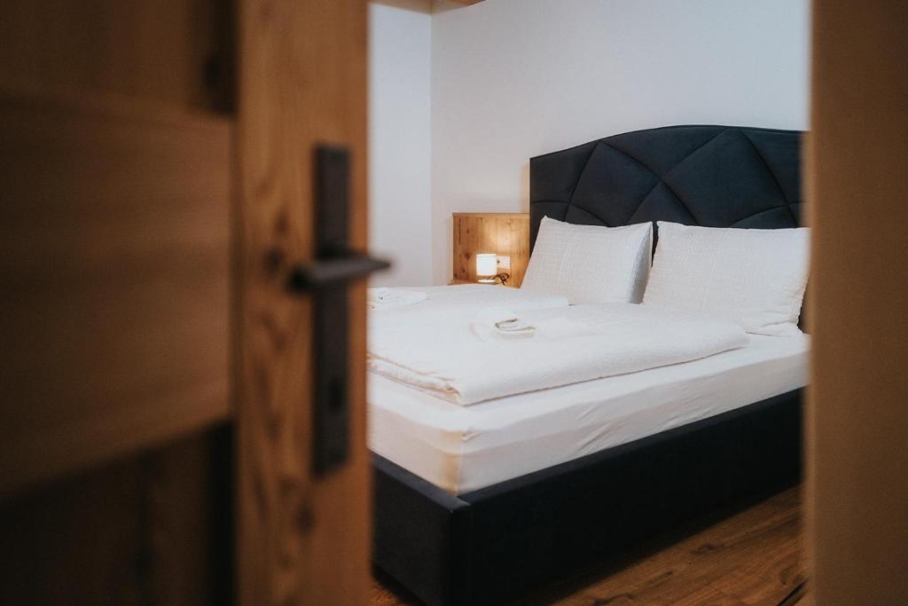 Postel nebo postele na pokoji v ubytování Alpin Chalet Samer