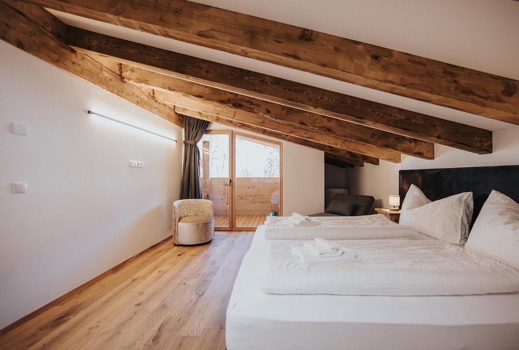 Postel nebo postele na pokoji v ubytování Alpin Chalet Samer