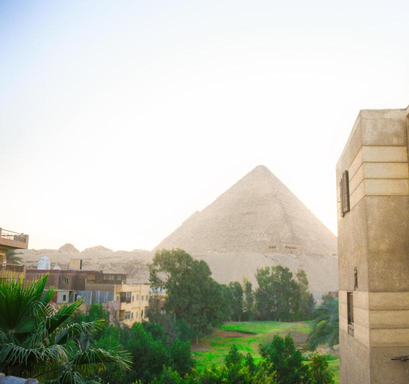a view of the pyramids from the citadel at نزله البطران in Cairo