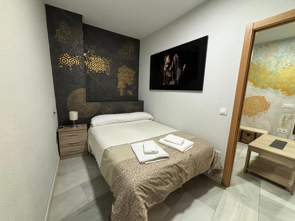 เตียงในห้องที่ Apartamento céntrico en Plaza San Miguel