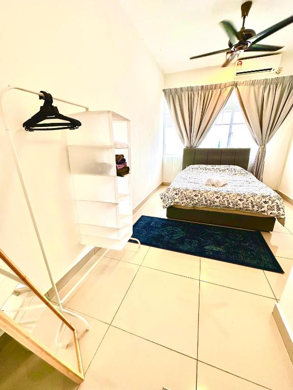 Postel nebo postele na pokoji v ubytování Casa Budi Dwiputra 15 Putrajaya