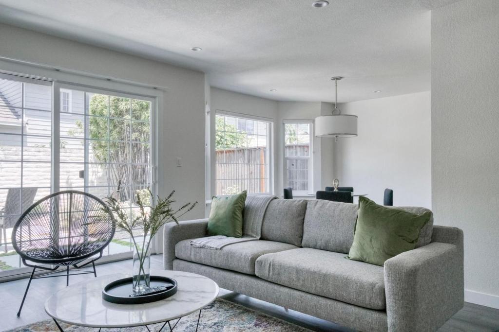 a living room with a couch and a table at Milpitas 2br w backyard pool nr park trails SFO-1604 in Milpitas