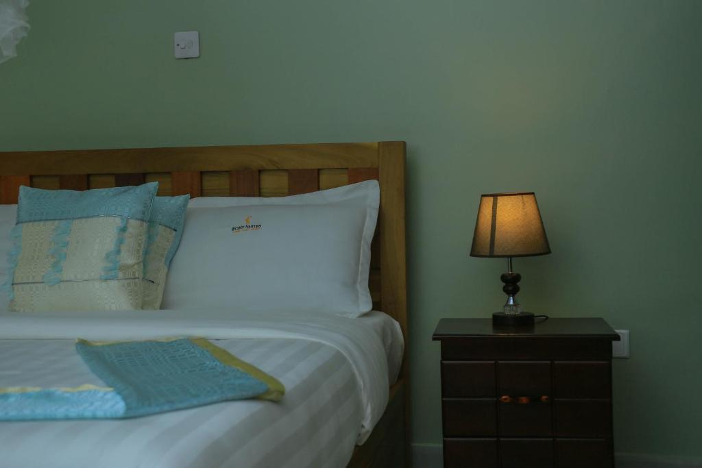 Postel nebo postele na pokoji v ubytování Fort Suites