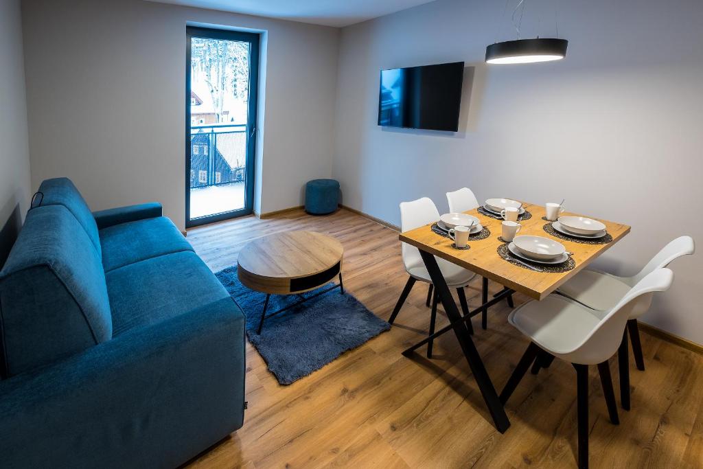 TV a/nebo společenská místnost v ubytování Apartmány Jarmilka s privátním wellness