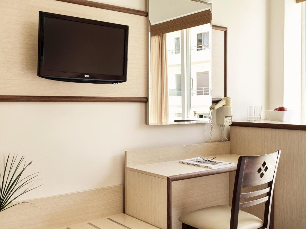 TV a/nebo společenská místnost v ubytování Pearl Hotel