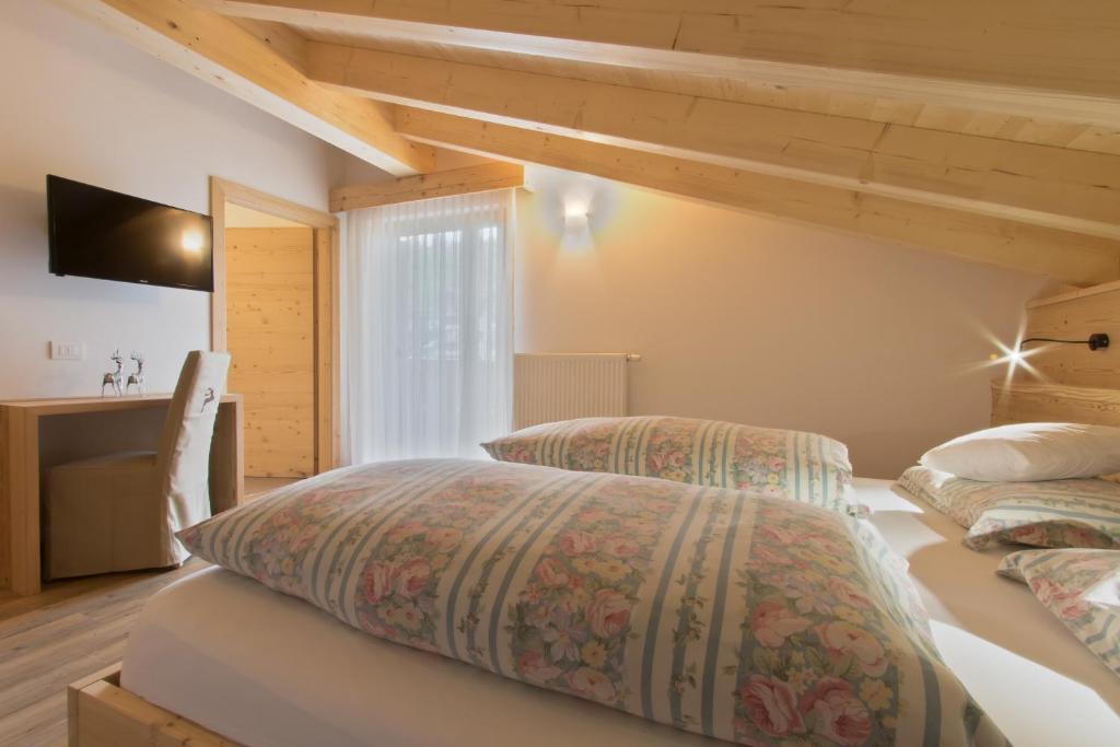 Postel nebo postele na pokoji v ubytování Hotel Steinrösl