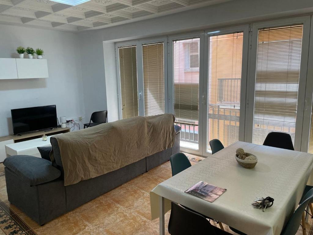 a living room with a couch and a table at PARRA HOME y Garaje, Algemesi Home in Algemesí