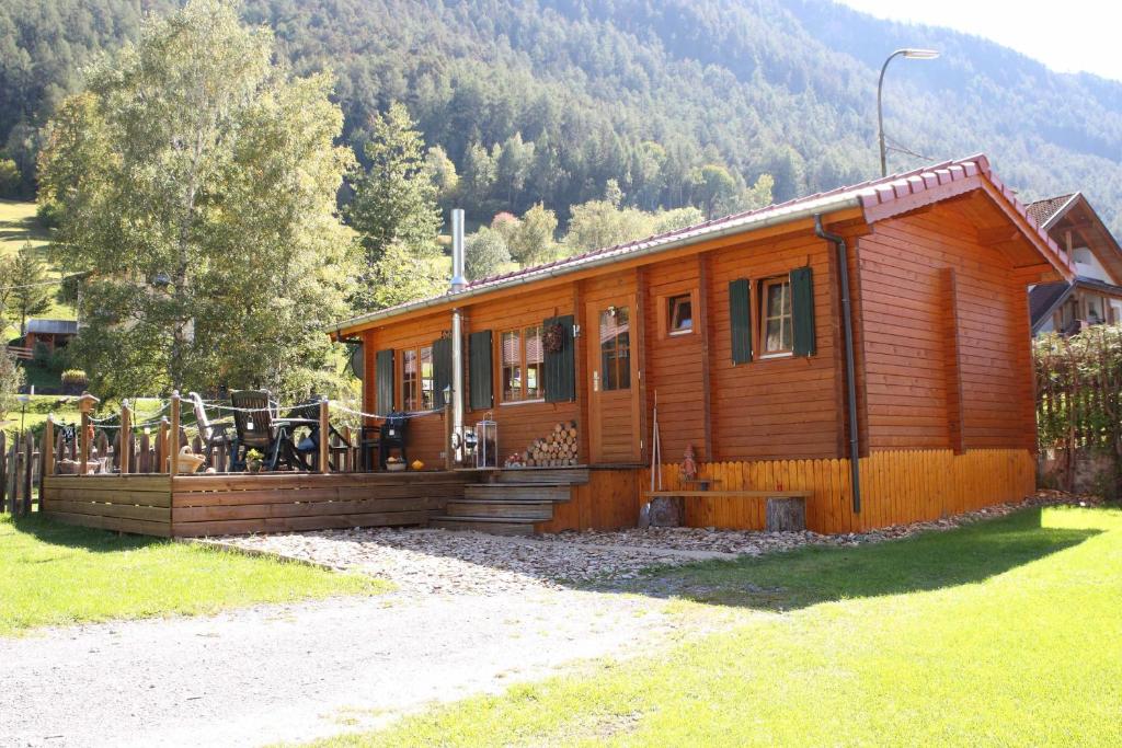 a wooden cabin in the middle of a mountain at Blockhütte Tirol in Ried im Oberinntal