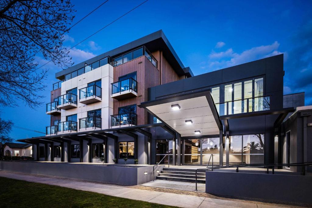 a house with a black and white facade at Quality Hotel Lakeside in Bendigo
