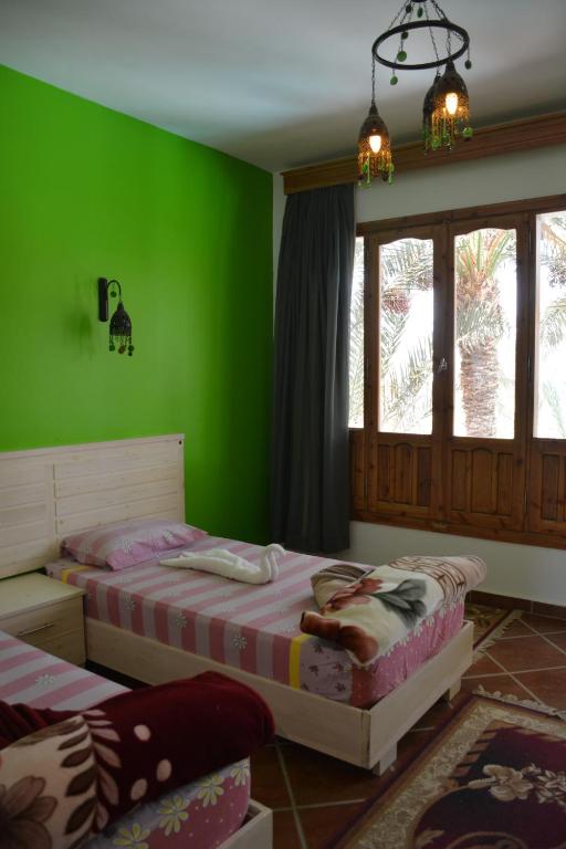 Postel nebo postele na pokoji v ubytování Dahab Divers