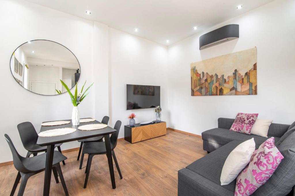 TV a/nebo společenská místnost v ubytování Piombino Apartments - Casa Chiassatello