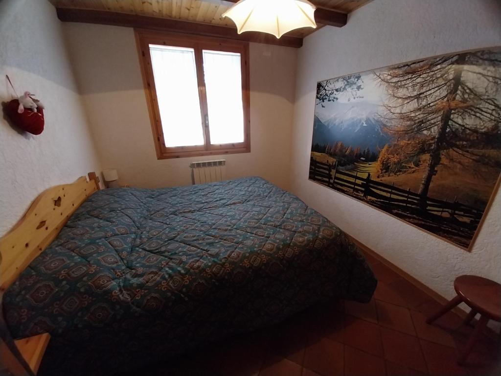 Ένα ή περισσότερα κρεβάτια σε δωμάτιο στο Casa vacanze Pievepelago