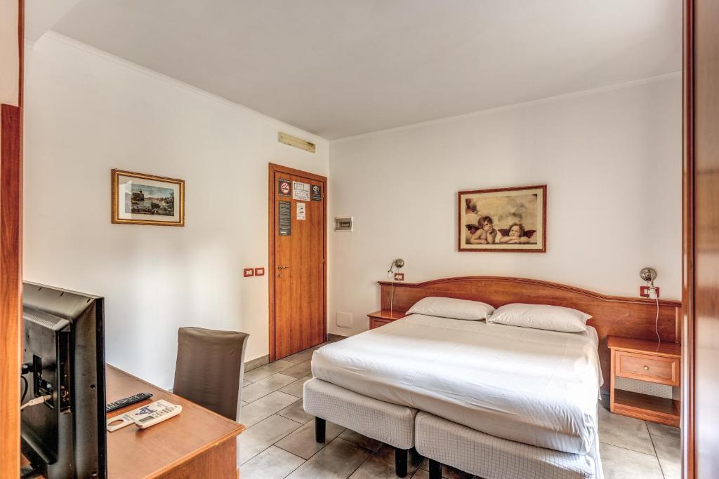 Letto o letti in una camera di Guest House Masterintrastevere