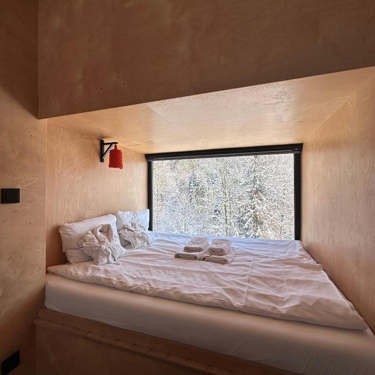 Postel nebo postele na pokoji v ubytování Apartamenty Szuflandia z sauną, jacuzzi, przy stoku narciarskim