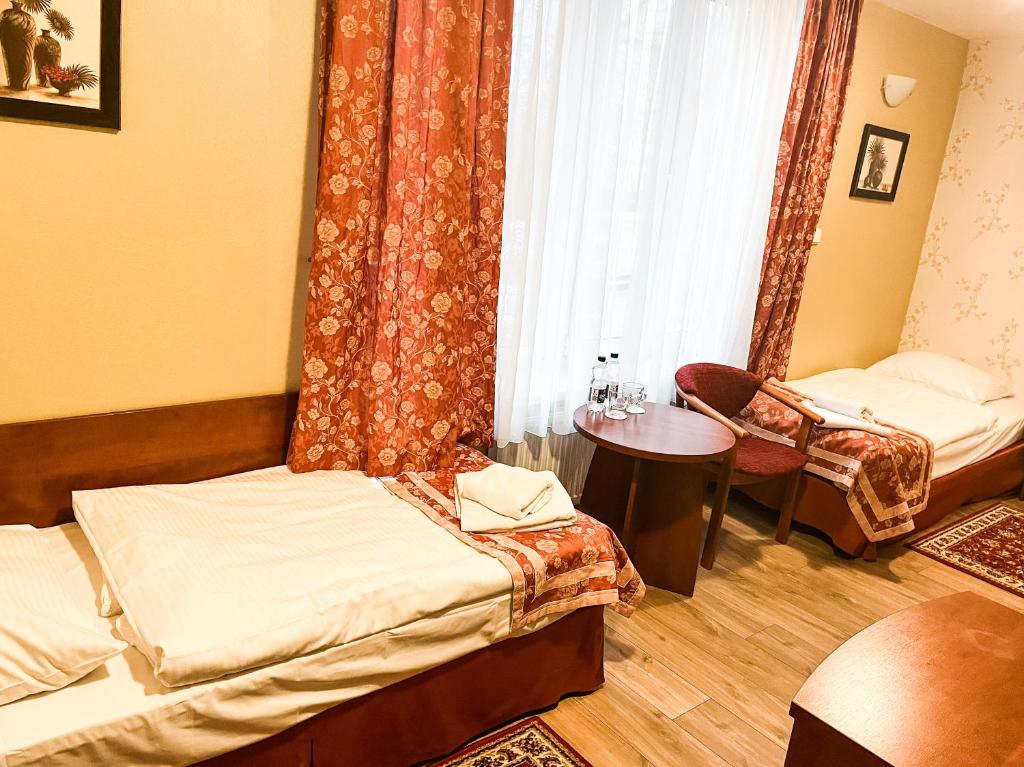 Posteľ alebo postele v izbe v ubytovaní Hotel Logos