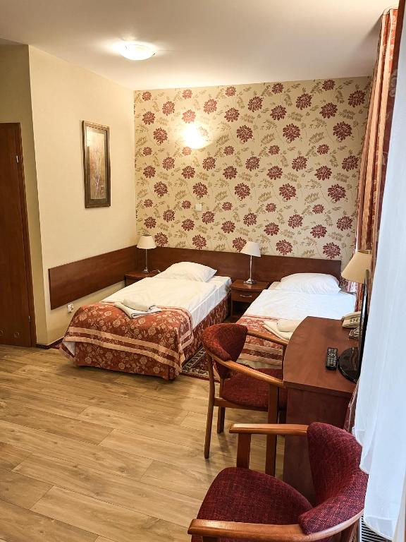 Posteľ alebo postele v izbe v ubytovaní Hotel Logos