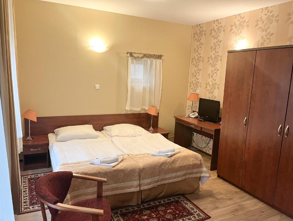 Posteľ alebo postele v izbe v ubytovaní Hotel Logos