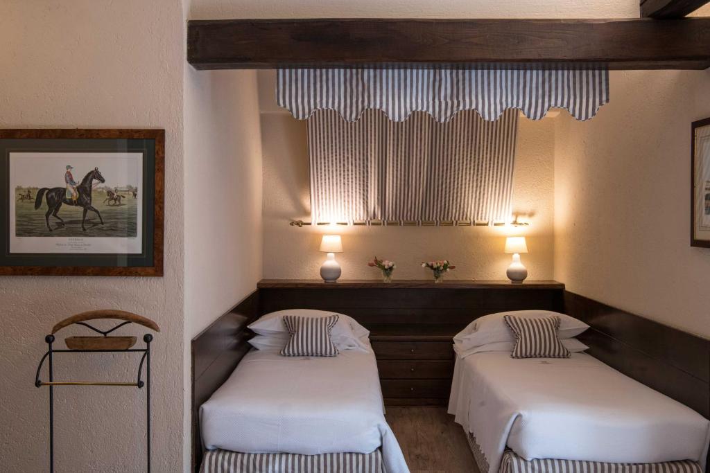 Posteľ alebo postele v izbe v ubytovaní La Meridiana ReIais & Chateaux