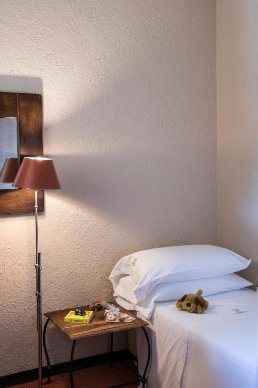 Posteľ alebo postele v izbe v ubytovaní La Meridiana ReIais & Chateaux