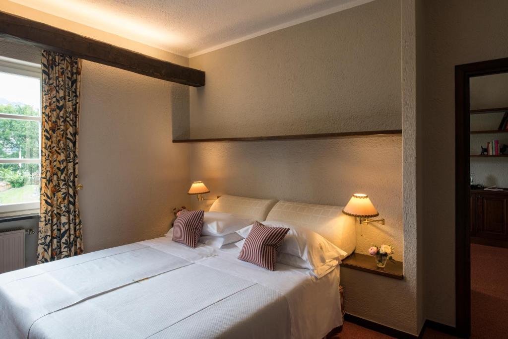 Posteľ alebo postele v izbe v ubytovaní La Meridiana ReIais & Chateaux