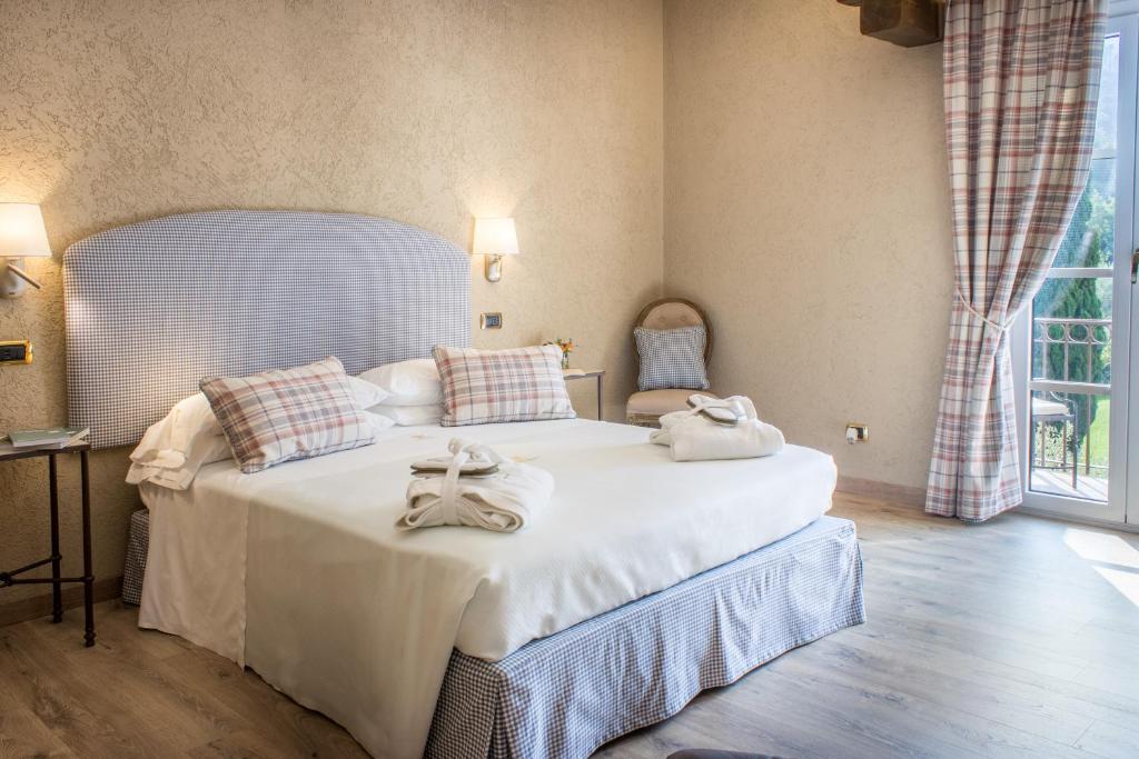 Posteľ alebo postele v izbe v ubytovaní La Meridiana ReIais & Chateaux