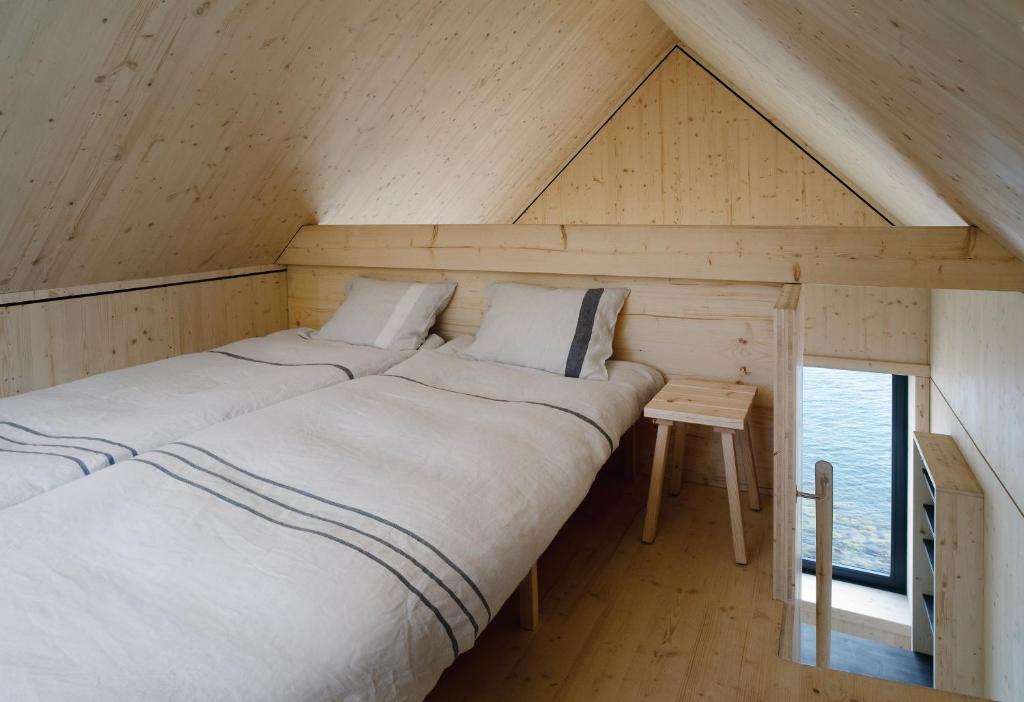 Postel nebo postele na pokoji v ubytování Majamaja Helsinki off-grid retreat