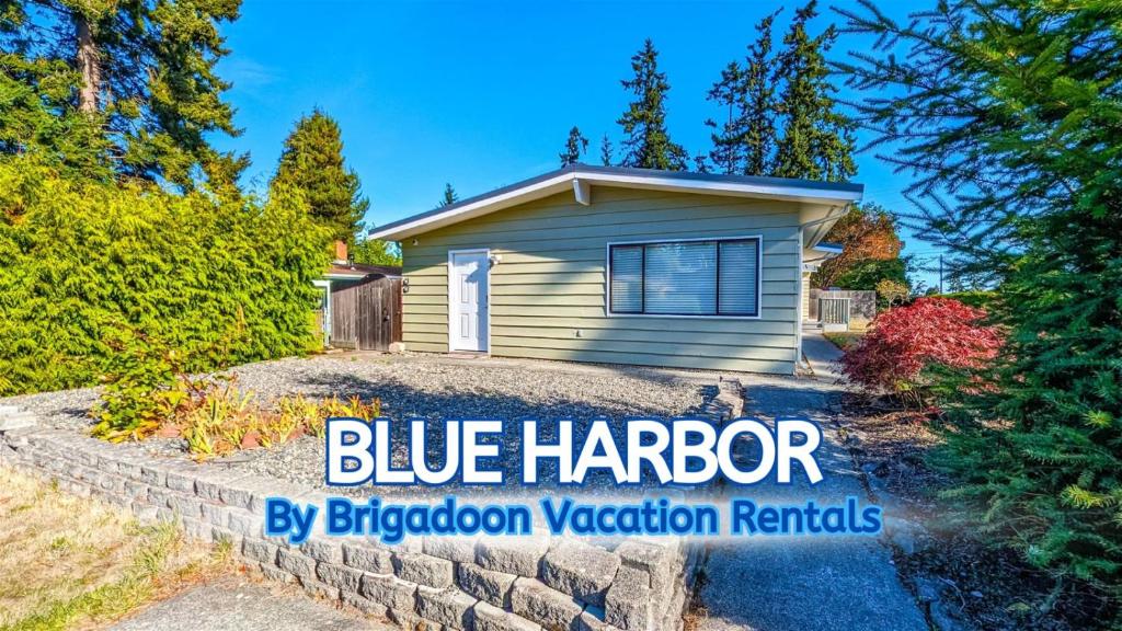 a house with the blue harrier sign in front of it at PA Blue Harbor in Port Angeles