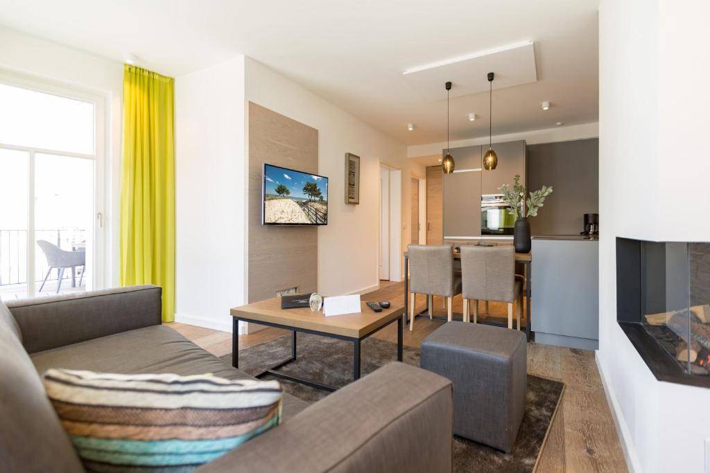 TV a/nebo společenská místnost v ubytování Beachhouse Bansin App 15