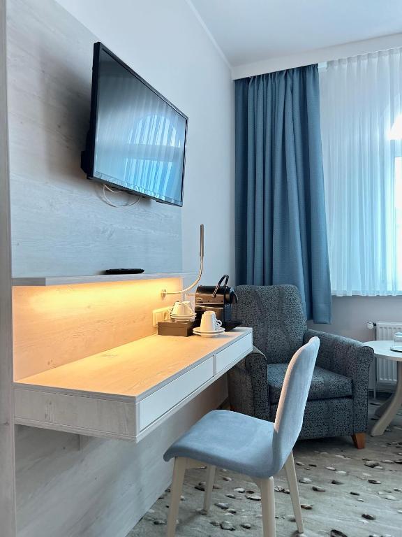 TV a/nebo společenská místnost v ubytování Sure Hotel by Best Western Wilhelmshaven City
